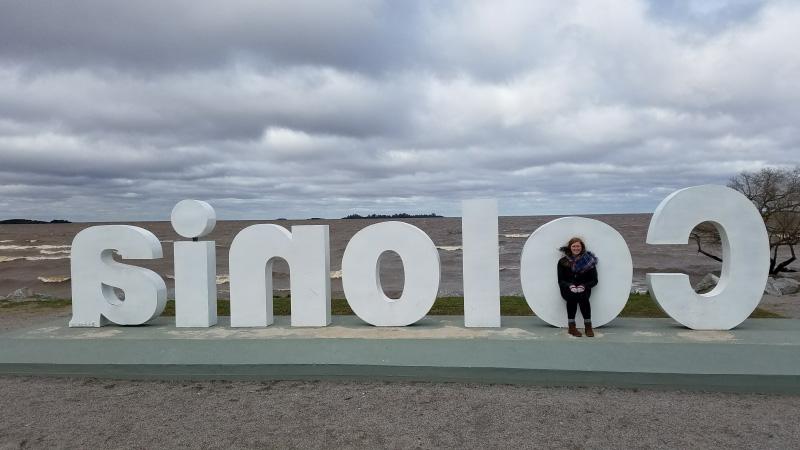 Elizabeth standing in the 'O' of the Colonia city sign.